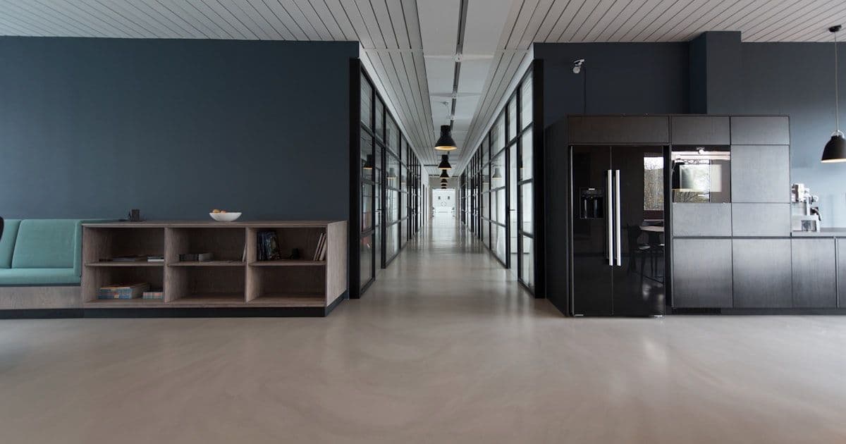 Modern shopping mall interior with interactive kiosk directory